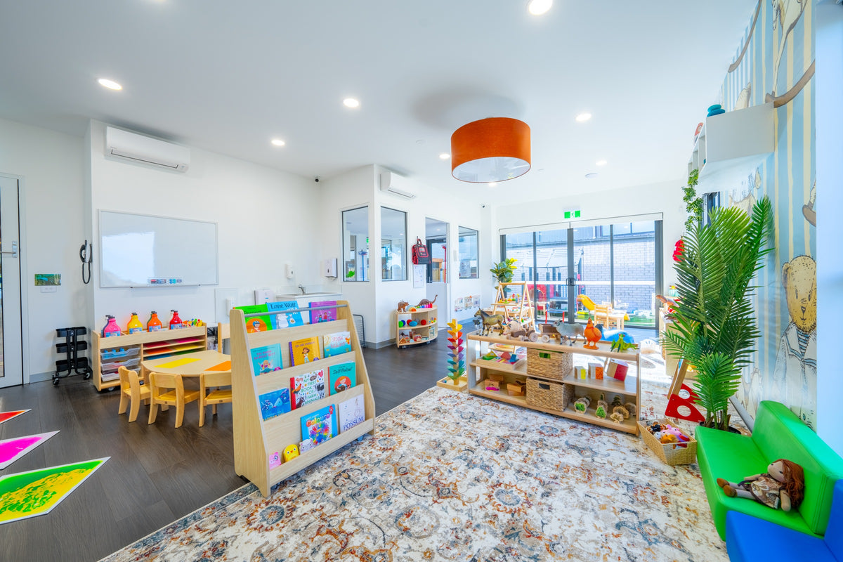 Furnished Learning Ladder Preston room with a book display, timber chairs and storage