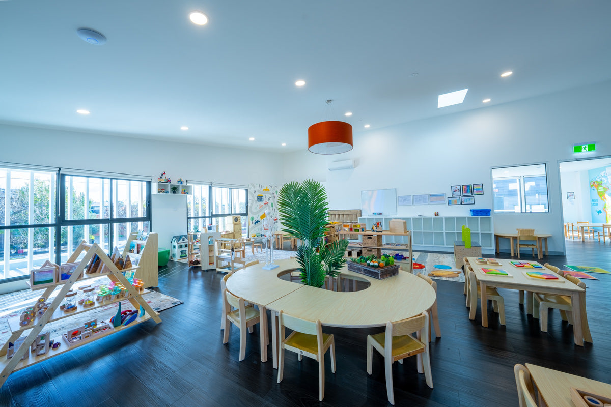 Timber tables, chairs and low play storage at Learning Ladder Preston