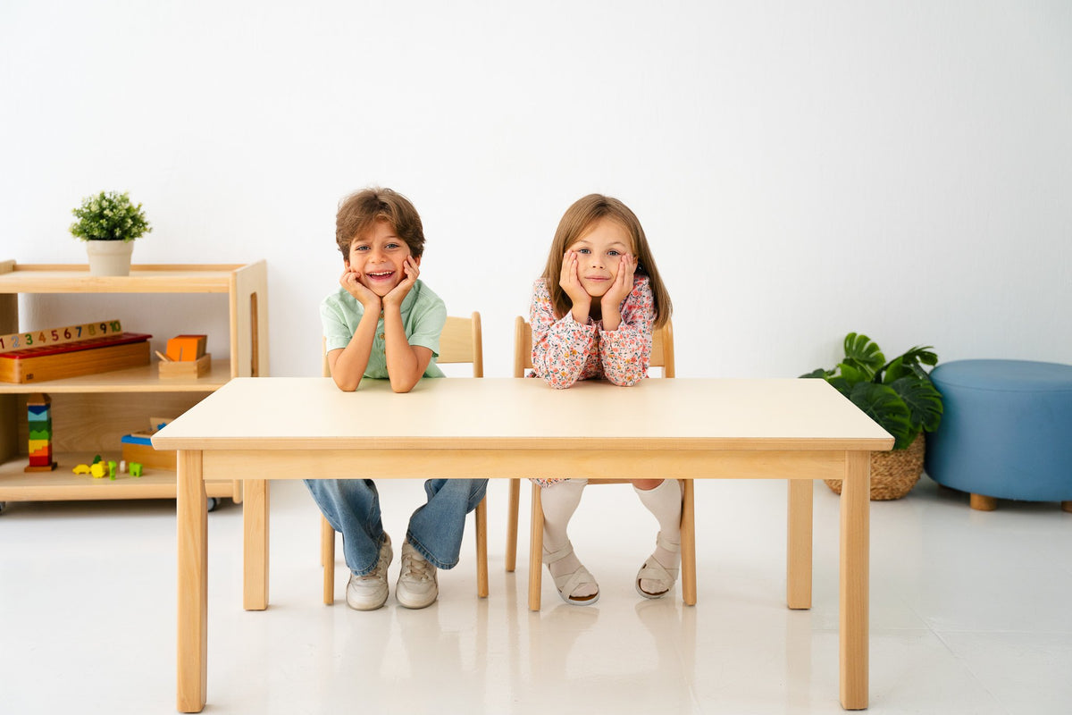 Two children at an Edu Fun beech table and chairs