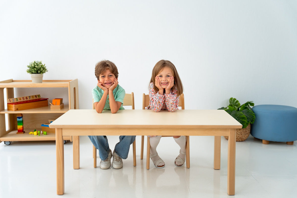 Two children at an Edu Fun wooden table in a bright playroom